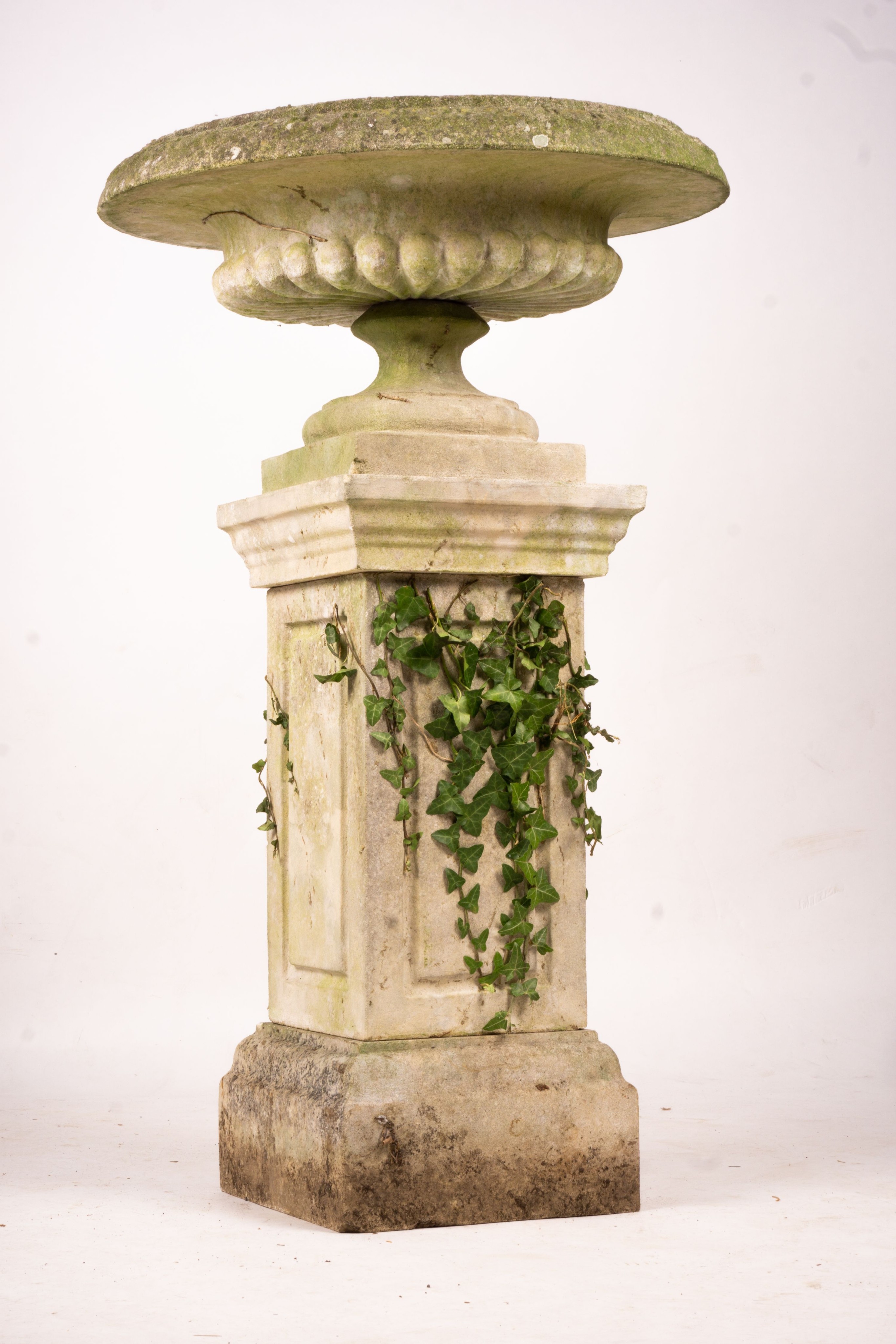 A reconstituted stone garden bird bath combined sundial on square pedestal base, height 108cm